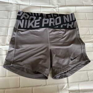 Nike Pro Dri-Fit with x cross waist band shorts. Gray. Women’s size small.